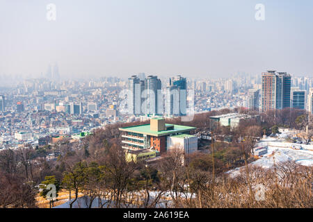 Aerial view of downtown with lots of skyscrapers and rooftops in Seoul, view from the Namsan Mountain in south central Seoul, South Korea. Stock Photo