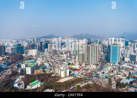 Aerial view of downtown with lots of skyscrapers and rooftops in Seoul, view from the Namsan Mountain in south central Seoul, South Korea. Stock Photo