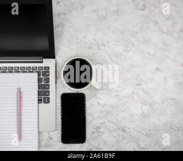 Top View of Modern Elegant Workspace Office with Laptop, Coffee, Phone and Notepad Stock Photo