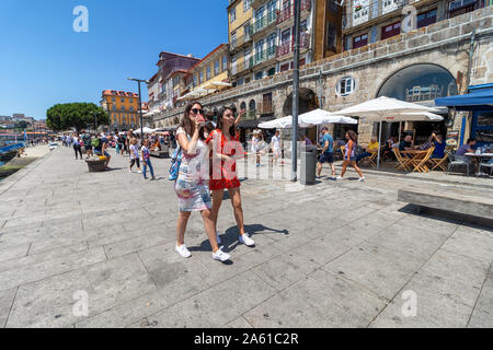 Porto, Portugal, July 19, 2019: Tourist walking in Porto old town, Portuga Stock Photo