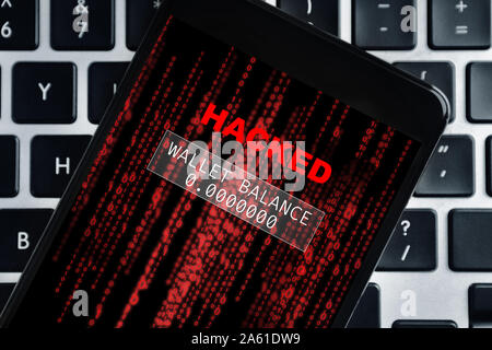 Smartphone with hacked digital wallet notification on screen Stock Photo