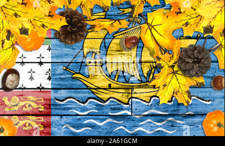 Saint Pierre and Miquelon flag on autumn wooden background with leaves and good place for your text Stock Photo
