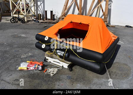 Inflated life raft on land Stock Photo