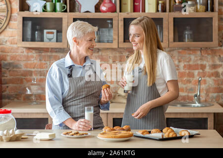 Young woman spending time with her aged mom Stock Photo