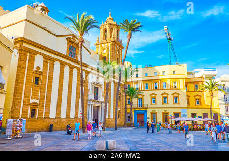 CADIZ, SPAIN - SEPTEMBER 19, 2019: The beautiful Andalucian architecture of the buildings in Plaza de la Catedral with magnificent walls of Santiago C Stock Photo