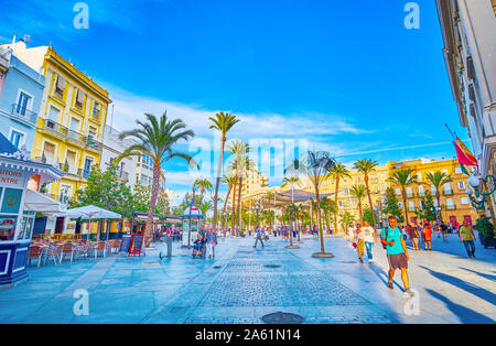 CADIZ, SPAIN - SEPTEMBER 19, 2019: The Plaza de San Juan de Dios is one of the largest squares in old town with numerous restaurants, shops, and other Stock Photo