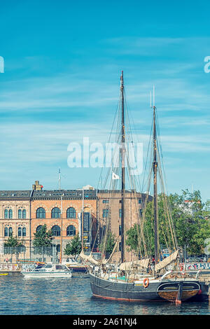 COPENHAGEN, DENMARK - SEPTEMBER 21, 2019: A tall ship sits moored at port on the cities river. Stock Photo