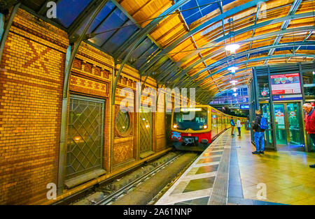 BERLIN, GERMANY - OCTOBER 3, 2019: The old train of the U-bahn line arrives to the covered Hackescher Markt station, on October 3 in Berlin Stock Photo