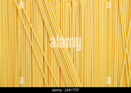 Types of uncooked pasta. Pasta spaghetti dry. Shooting from above. Flat lay, top view, filled frame. Stock Photo