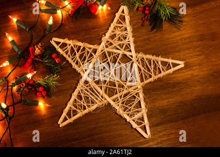 Christmas ornaments on a wooden table with christmas lights Stock Photo
