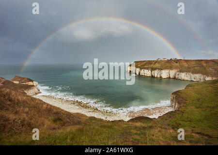 Rainbow (double) over Thornwick Bay, Flamborough Head, East Yorkshire, England, UK Stock Photo