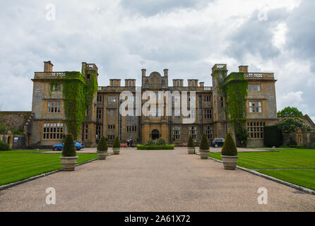 May 2019. Eynsham Hall is a Grade II listed mansion near North Leigh in Oxfordshire, England, United Kingdom. Beautiful wide-angle shot of the buildin Stock Photo