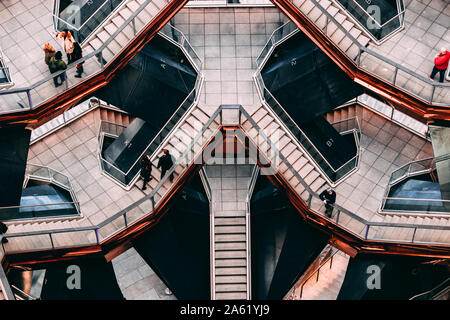 People exploring The Vessel from a distance, Hudson Yards, NYC. Stock Photo