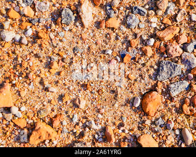 orange little stones. in the sun close up. Texture for the background. Stock Photo
