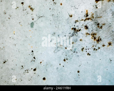 rust points on a blue background. blue wall texture deteriorated with rust points. Texture of painted grey metal with corrosion points.  Stock Photo