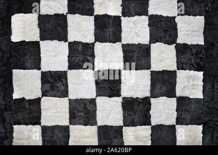 Close up of beautiful checkerboard style rug, fur texture, checkered background Stock Photo