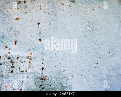 rust points on a blue background. blue wall texture deteriorated with rust points. Texture of painted grey metal with corrosion points.  Stock Photo