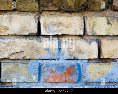 old brick wall. Front close-up view of an old brick wall. beige painted with paint Stock Photo