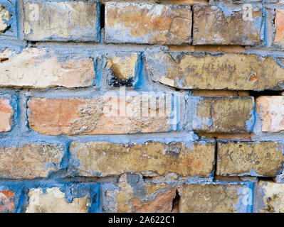 old brick wall. Front close-up view of an old brick wall. beige painted with paint Stock Photo