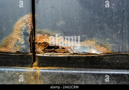 rust on the fender of the car Stock Photo