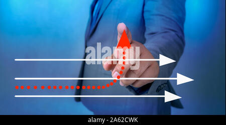 business different direction The hand of a business man is pointing to a business change point Stock Photo