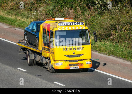 2002 Renault Midlum; Egertons Breakdon Recovery;  Haulage delivery trucks, lorry, transportation, truck, 24hr emergency rescue vehicle, delivery, commercial transport industry on the M6 at Lancaster, UK Stock Photo