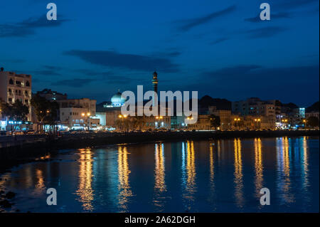 A mosque is lit up at night along the Corniche of Old Muscat, Oman Stock Photo