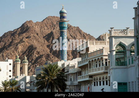 Mosque minaret and old houses along the Corniche of Old Muscat, Oman Stock Photo