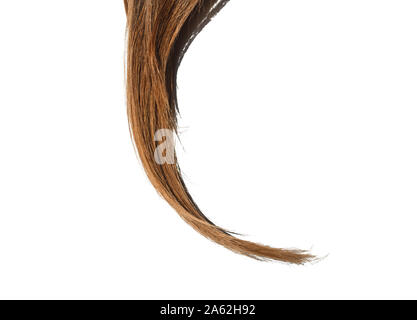 Piece of natural, long, dyed blond and brown hair on white isolated background. Shiny Healthy colored hair lock closeup. Stock Photo