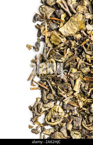 Dried green tea leaves isolated on white background. Stock Photo
