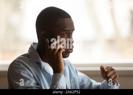 Young black man calling to support call center, problem solving. Stock Photo