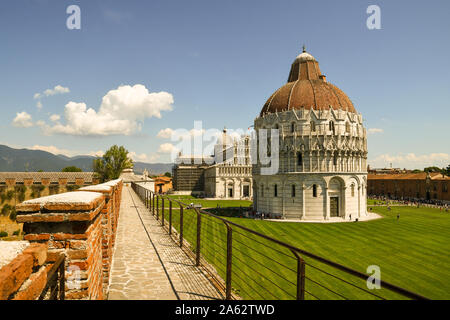 Elevated view of Piazza dei Miracoli in Pisa with the Baptistry of St John and the Cathedral from the walkway of the city walls, Tuscany, Italy Stock Photo