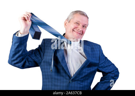 An elderly man in a suit pulls himself by a tie. Isolated on a white background. Stock Photo