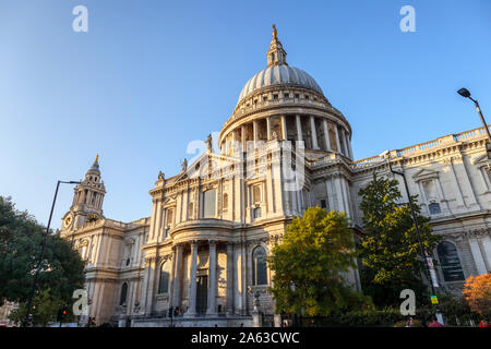 View from St Paul's Churchyard of the London landmark, historic St Paul's Cathedral and dome designed by Sir Christopher Wren on a sunny autumn day Stock Photo