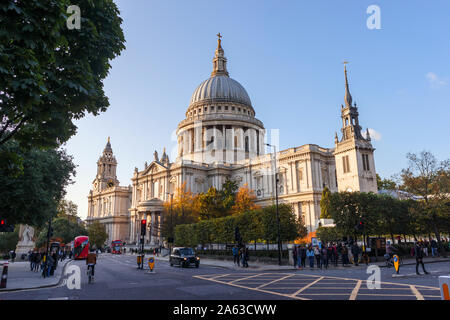 View from St Paul's Churchyard of the London landmark, historic St Paul's Cathedral and dome designed by Sir Christopher Wren on a sunny autumn day Stock Photo