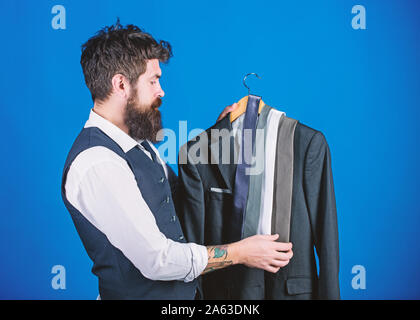 Stylist advice. Matching necktie with outfit. Man bearded hipster