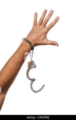 Concept on the theme of freedom. Mans hand in handcuffs isolated on white background Stock Photo