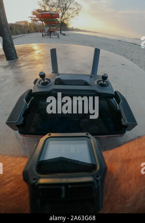 Gadgets for drone control and hand watches for multicopter control on the beach Stock Photo