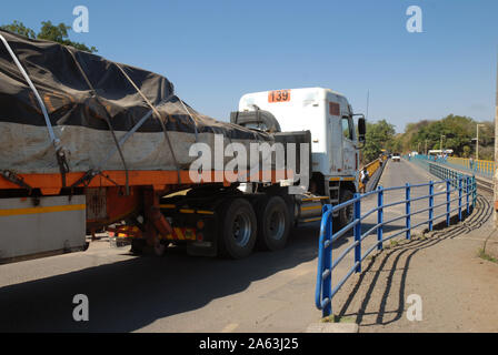 Lorry transporting goods on the Victoria Falls Bridge over the Zambezi River, from Zimbabwe to Zambia, Africa. Stock Photo