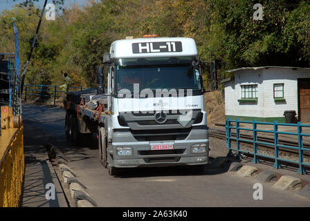 Lorry transporting goods on the Victoria Falls Bridge over the Zambezi River, from Zimbabwe to Zambia, Africa. Stock Photo