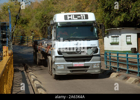 Lorry transporting goods on the Victoria Falls Bridge over the Zambezi River, from Zimbabwe to Zambia, Africa. Stock Photo