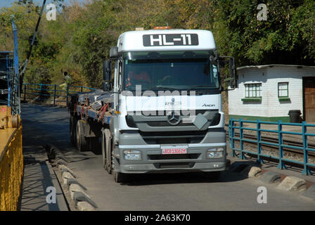 Lorry transporting goods on the Victoria Falls Bridge over the Zambezi River, from Zimbabwe to Zambia, Africa. Stock Photo