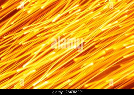 Futuristic blurred lights holiday monochrome background in yellow. Horizontal, soft focus Stock Photo