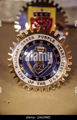 Punta Gorda, Florida, USA – October 13, 2019: Military Order Purple Heart Grill ornament displayed at the Muscle Car City museum. Editorial Use Stock Photo