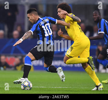 Milan, Italy. 23rd Oct, 2019. FC Inter's Lautaro Martinez (L) vies with Borussia Dortmund's Axel Witsel during the UEFA Champions League Group F soccer match between FC Inter and Borussia Dortmund in Milan, Italy, Oct. 23, 2019. Credit: Alberto Lingria/Xinhua/Alamy Live News Stock Photo