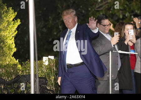 Washington, United States. 23rd Oct, 2019. United States President Donald J. Trump waves to the press as he arrives at the White House in Washington, DC following a trip to Pittsburgh, Pennsylvania on Wednesday, October 23, 2019. Photo by Ron Sachs/UPI Credit: UPI/Alamy Live News Stock Photo