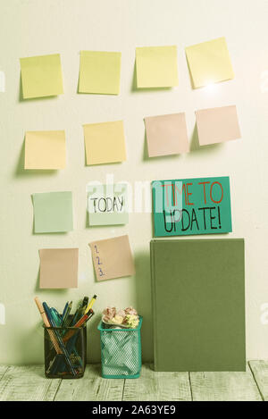 Conceptual hand writing showing Time To Update. Concept meaning this is right moment to make something more modern new Sticky Notes Card on Wall Penci Stock Photo