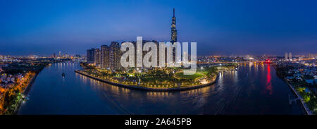 epic evening aerial panorama of Saigon, Ho Chi Minh City, Vietnam featuring all key buildings of the city skyline and the Saigon riverfront Stock Photo