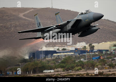 An F-15C Eagle assigned to the 493rd Fighter Squadron launches for a sortie in support of the Spanish-led air-to-air combat training exercise, OCEAN SKY 19 at Gando Air Base Oct. 23, 2019. Exercises like OCEAN SKY remain a symbol of the shared commitment between Spain, the U.S. and NATO to maintaining the continued security of Europe. (U.S. Air Force photo/ Tech. Sgt. Matthew Plew) Stock Photo