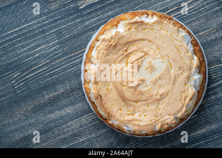 Top view of whole homemade apple pie on wooden table, close up. Copy space Stock Photo